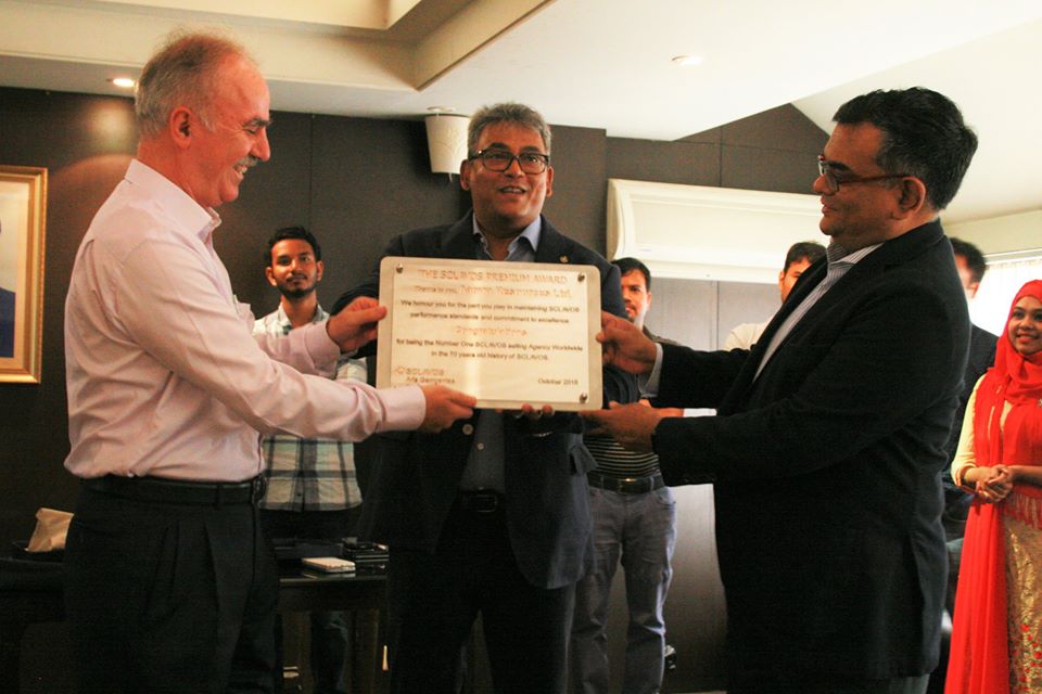 Figure : Sclavos CEO Aris Georgantas (L) handing over 'The SCLAVOS Premium Award' to Syed Faruque Ahmed, Chairman of aamra companies (R), &  Syed Farhad Ahmed, Managing Director of aamra companies (M).