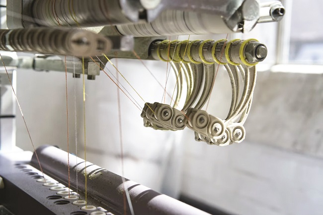 How does power quality impact textile manufacturing costs?